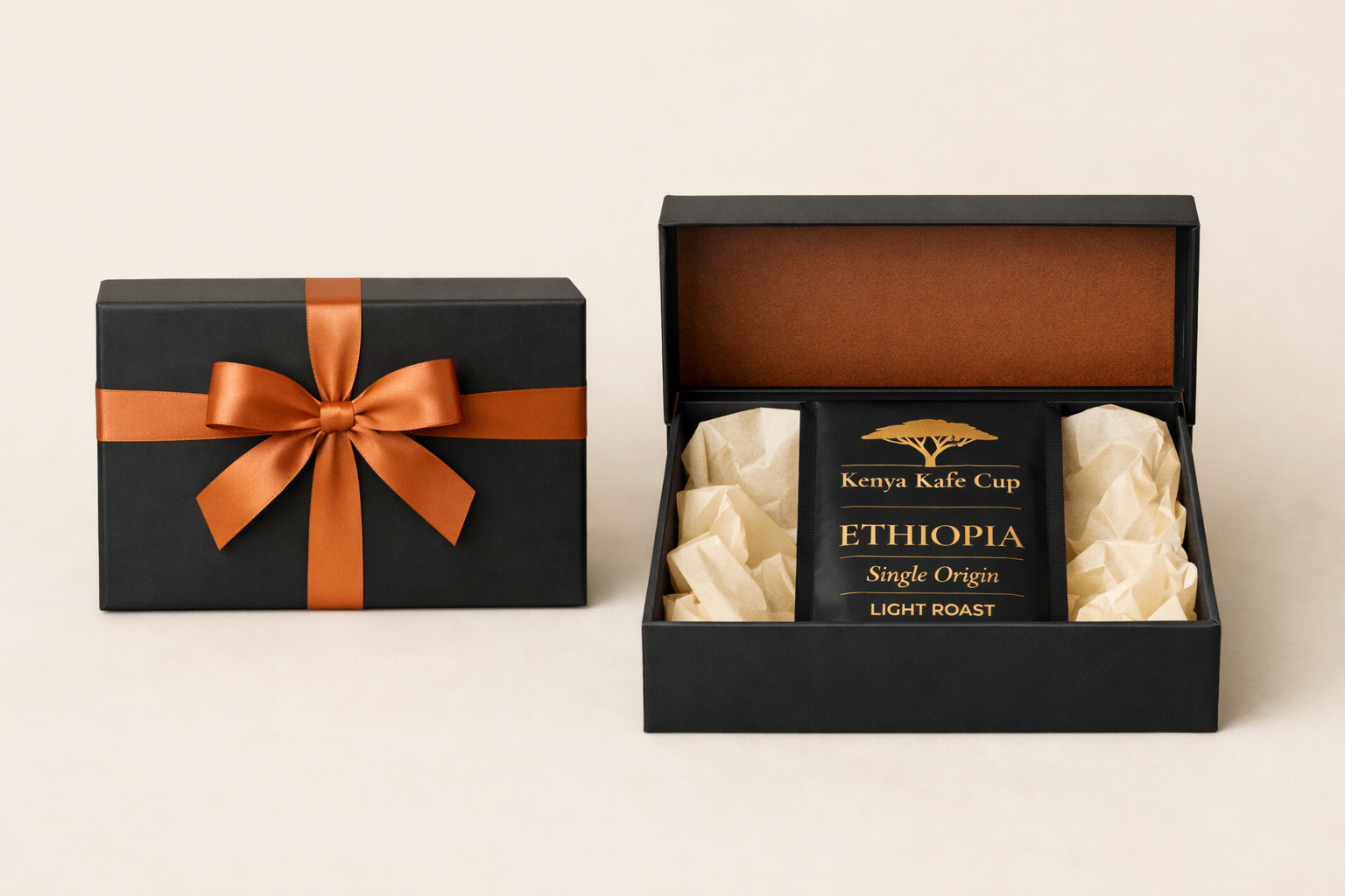 Premium Kenya Kafe Cup Ethiopia Light Roast coffee gift box black packaging with orange ribbon and gold accents, presented on a beige background.