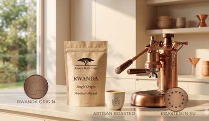 Kenya Kafe Cup Rwanda Single Origin Medium Roast coffee bag displayed on a sunlit kitchen counter beside a steaming cup and copper espresso machine. Warm, minimalist composition highlighting Rwanda origin, artisan roasting, and European craftsmanship
