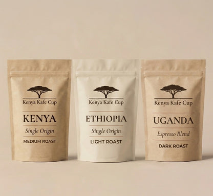 Kenya Kafe Cup coffee lineup featuring Kenya Single Origin Medium Roast, Ethiopia Single Origin Light Roast, and Uganda Espresso Blend Dark Roast. Minimalist packaging design on a neutral background highlighting origin diversity and premium craftsmanship.